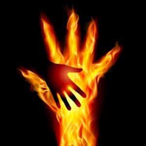 Big and small hand in flames